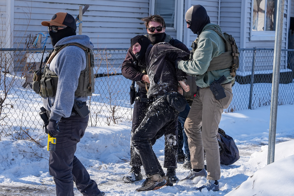 A person is detained by federal agents on Tuesday, Feb. 3, 2026, in Minneapolis. (AP Photo/Ryan Murphy)
