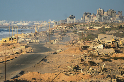 Israeli tanks are positioned on the coastal road leading to Gaza City near Wadi Gaza, in the central Gaza Strip, Thursday, Oct. 9, 2025. (AP Photo/Abdel Kareem Hana) Israeli tanks are positioned on the coastal road leading to Gaza City near Wadi Gaza, in the central Gaza Strip, Thursday, Oct. 9, 2025. (AP Photo/Abdel Kareem Hana)