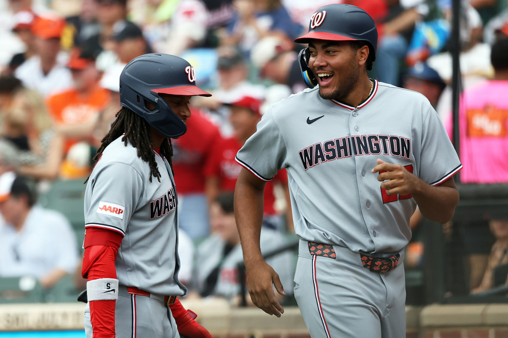 Washington Nationals' James Wood, right, celebrates with teammate CJ Abrams, left, after scoring during the third inning of a baseball game against the Baltimore Orioles, Sunday, June 28, 2026, in Baltimore. (AP Photo/Daniel Kucin Jr.)