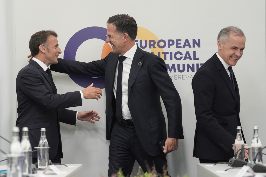 France's President Emmanuel Macron, from left, NATO Secretary General Mark Rutte and Canada's Prime Minister Mark Carney attend the European Political Community summit in Yerevan, Armenia, Monday May 4, 2026. (Stefan Rousseau/Pool Photo via AP)