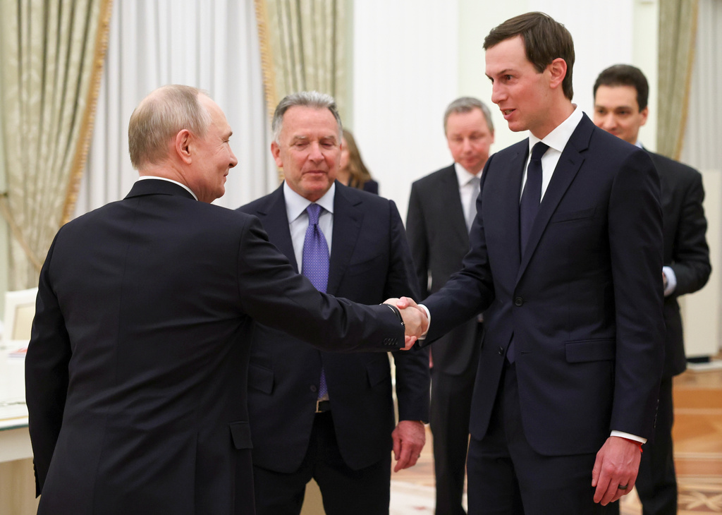 Russian President Vladimir Putin, left, greets U.S. President Donald Trump's envoys Steve Witkoff, center, and Jared Kushner at the Senate Palace of the Kremlin, in Moscow, Thursday, Jan. 22, 2026. (Alexander Kazakov/Sputnik, Kremlin Pool Photo via AP)