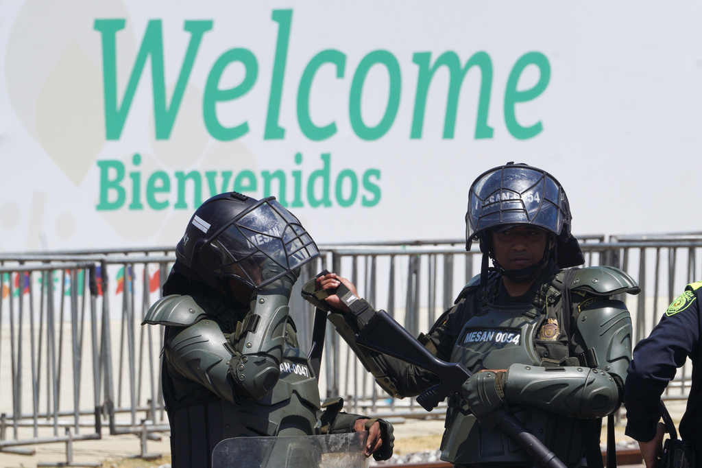 Security personnel work outside of a conference aimed at transitioning away from fossil fuels Tuesday, April 28, 2026, in Santa Marta, Colombia. (AP Photo/Ivan Valencia)