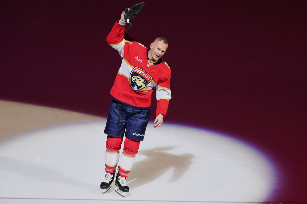 Florida Panthers left wing Brady Tkachuk acknowledges the crowd after scoring a game winning goal during overtime in an NHL hockey game against the Vancouver Canucks, Thursday, Oct. 15, 2026, in Sunrise, Fla. (AP Photo/Lynne Sladky)