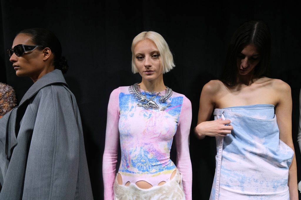 A model wears a creation part of the Diesel's Spring Summer 2026 collection in the backstage ahead of the collection's show, in Milan, Italy, Tuesday, Sept. 23, 2025. (AP Photo/Antonio Calanni)