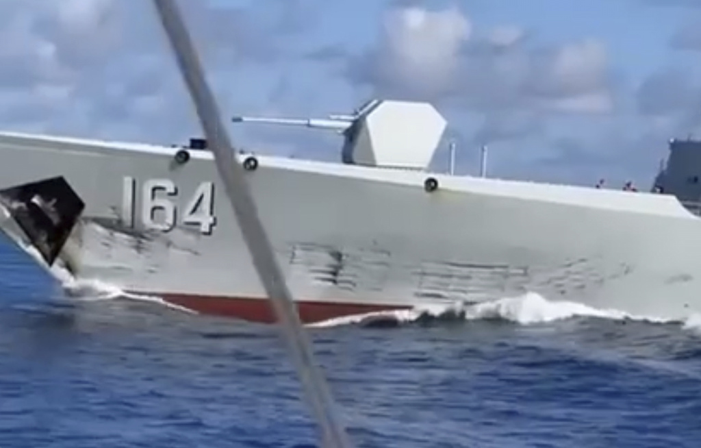 In this photo, taken from video and provided by the Philippine Coast Guard, a damaged Chinese Navy ship after an accidental collision with a Chinese Coast Guard vessel while chasing a Philippine fisheries boat near Scarborough Shoal in the disputed South China Sea on Monday Aug. 11, 2025. (Philippine Coast Guard via AP)