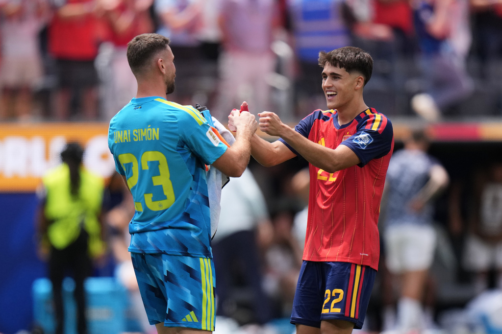Spain goalkeeper Unai Simon (23) celebrates with Pau Cubarsi (22) after the World Cup round of 32 soccer match between Spain and Austria in Inglewood, Calif., near Los Angeles, Thursday, July 2, 2026. (AP Photo/Jae C. Hong)