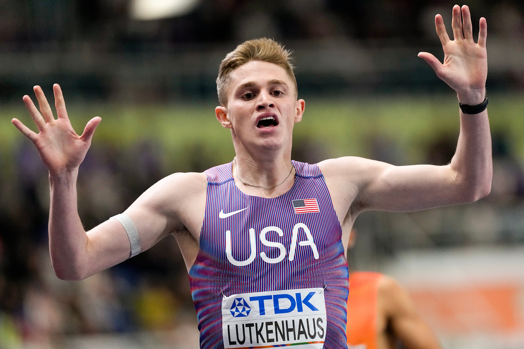 Cooper Lutkenhaus, of the United States, reacts as he crosses the finish line to win a gold medal in the men's 800 meters final at the World Athletics Indoor Championships in Torun, Poland, Sunday, March 22, 2026. (AP Photo/Petr David Josek)