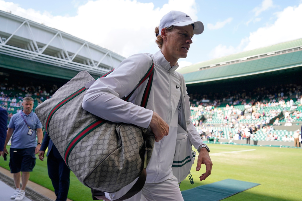 FILE - Italy's Jannik Sinner walks off court after defeating Colombia's Daniel Elahi Galan in the men's singles match on day seven of the Wimbledon tennis championships in London, July 9, 2023. (AP Photo/Alberto Pezzali, File)