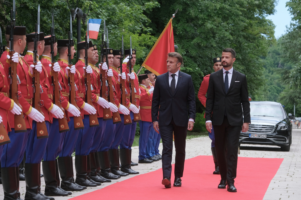 French President Emmanuel Macron, left, reviews the honor guard with Montenegro's President Jakov Milatovic during a welcome ceremony in Cetinje, Montenegro, Thursday, June 4, 2026. (AP Photo/Risto Bozovic)