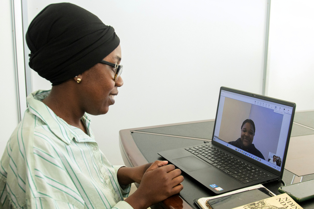 Shungu Constance Chidovi conducts an online Shona lesson in Harare, Zimbabwe, Monday, July 20, 2026. (AP Photo/Aaron Ufumeli)