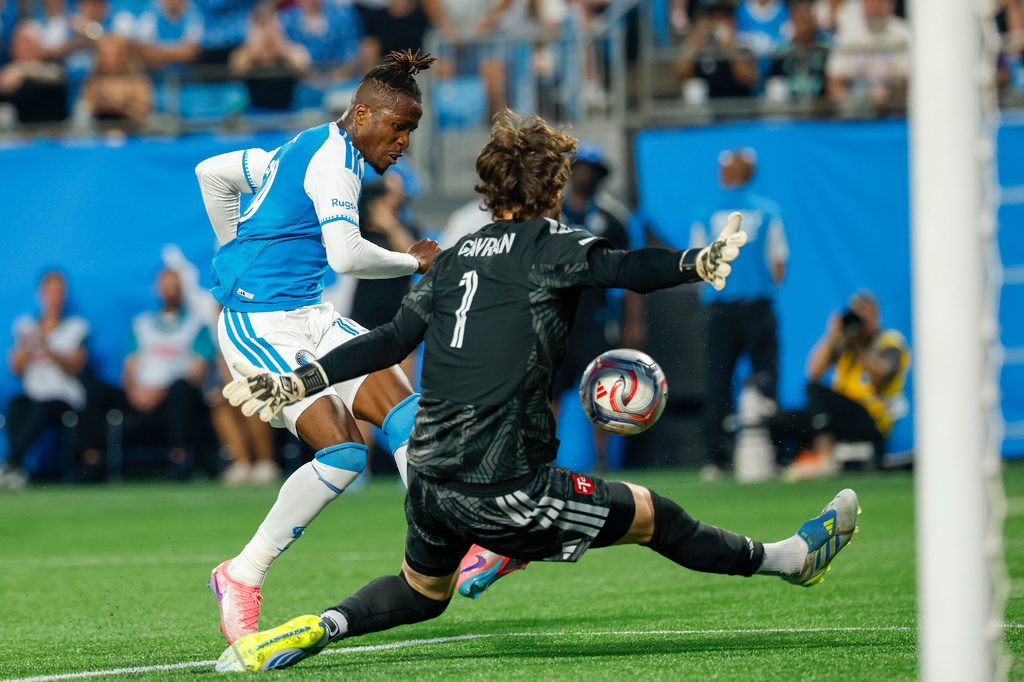 Toronto FC goalkeeper Luka Gavran (1) blocks a shot by Charlotte FC forward Wilfried Zaha, left, during the first half of an MLS soccer match in Charlotte, N.C., Saturday, May 16, 2026. (AP Photo/Nell Redmond)