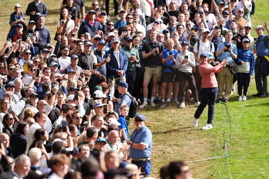 Rory McIlroy of Northern Ireland plays from the 1st fairway on day three of the PGA Championship at Wentworth Golf Club in Virginia Water, England, Saturday Sept. 19, 2026. (Adam Davy/PA via AP)