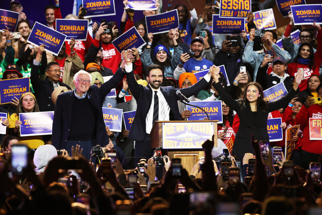 FILE - Sen. Bernie Sanders, I-Vt., left, New York City mayoral candidate Zohran Mamdani, center, and Rep. Alexandria Ocasio-Cortez, D-N.Y., appear on stage during a rally, Sunday, Oct. 26, 2025, in New York. (AP Photo/Heather Khalifa, File)