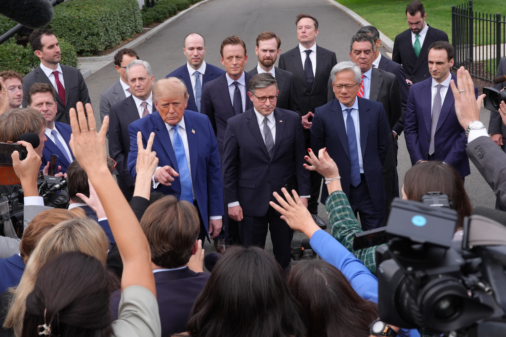 President Donald Trump speaks to reporters at the White House in Washington, Tuesday Sept. 29, 2026, after meeting with top executives of AI firms, as House Speaker Mike Johnson of La., and NVIDIA CEO Jensen Huang listen. (AP Photo/Jacquelyn Martin)