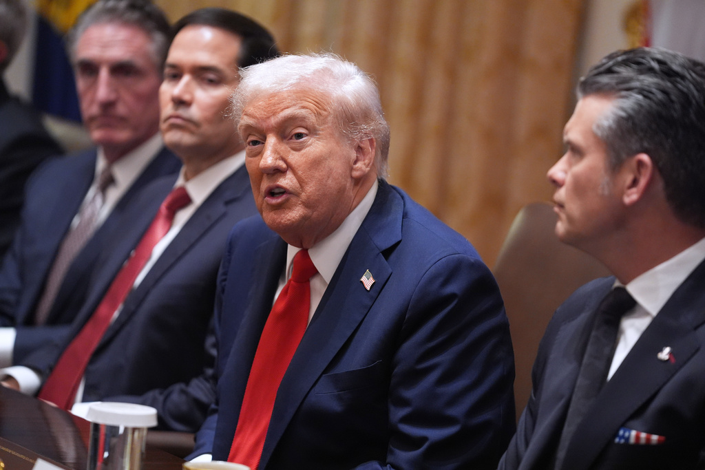 President Donald Trump speaks during a cabinet meeting at the White House, Thursday, Oct. 9, 2025, in Washington. From left are Interior Secretary Doug Burgum, Secretary of State Marco Rubio, Trump and Defense Secretary Pete Hegseth. (AP Photo/Evan Vucci)