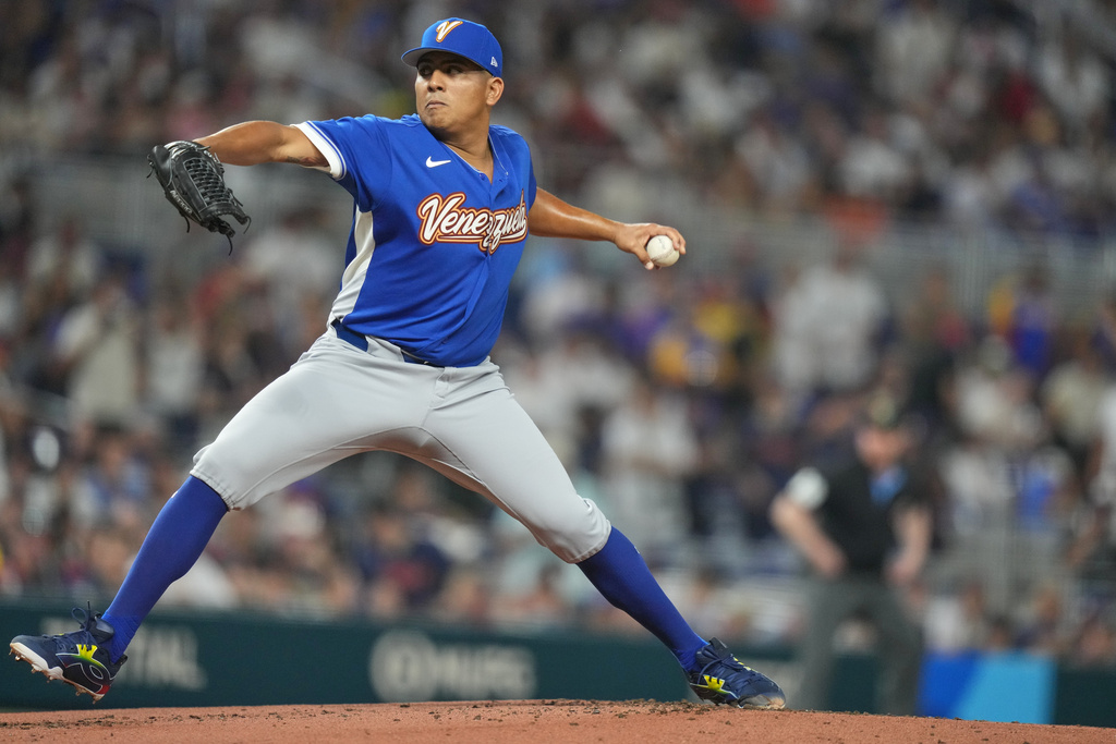 Venezuela's starting pitcher Ranger Suarez delivers a pitch during the first inning of a World Baseball Classic quarterfinal game, Saturday, March 14, 2026, in Miami. (AP Photo/Lynne Sladky)