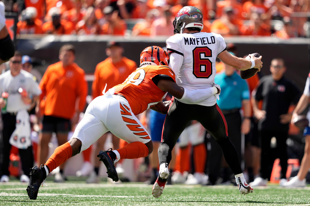 Tampa Bay Buccaneers quarterback Baker Mayfield (6) is sacked by Cincinnati Bengals linebacker Barrett Carter (49) and fumbles the ball in the first half of an NFL football game Sunday, Sept. 13, 2026, in Cincinnati. (AP Photo/Carolyn Kaster)