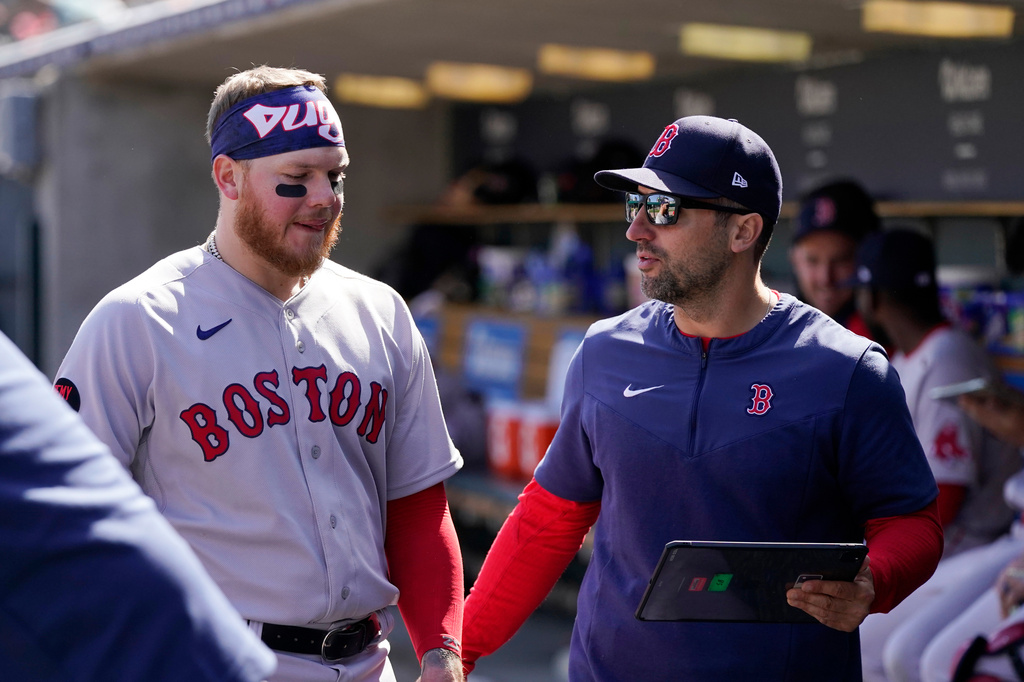FILE - Boston Red Sox left fielder Alex Verdugo, left, talks with hitter coach Peter Fatse, right, in the dugout during the eighth inning of a baseball game against the Detroit Tigers, April 12, 2022, in Detroit. (AP Photo/Carlos Osorio, File)