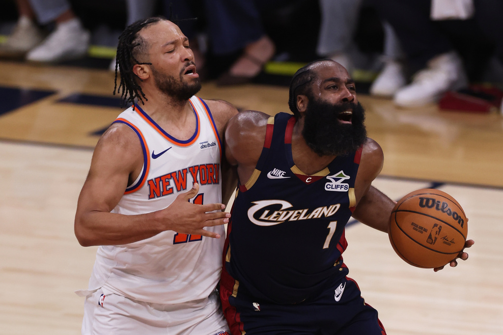 New York Knicks guard Jalen Brunson (11) defends against Cleveland Cavaliers guard James Harden (1) during the first half of Game 3 in the Eastern Conference finals NBA basketball playoffs series in Cleveland, Saturday, May 23, 2026. (AP Photo/Tim Phillis)