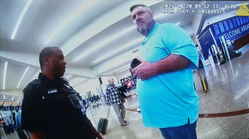 This image made from an Oct. 20, 2025, police body camera footage shows Billy Joe Cagle, of Cartersville, Ga., right, talks to police officers before he was arrested inside the domestic terminal at Hartsfield-Jackson Atlanta International Airport in Atlanta. (Atlanta Police Department via AP) This image made from an Oct. 20, 2025, police body camera footage shows Billy Joe Cagle, of Cartersville, Ga., right, talks to police officers before he was arrested inside the domestic terminal at Hartsfield-Jackson Atlanta International Airport in Atlanta. (Atlanta Police Department via AP)