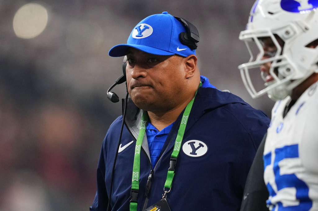 FILE - BYU head coach Kalani Sitake watches play against Texas Tech in the first half of a Big 12 Conference championship NCAA college football game on Dec. 6, 2025, in Arlington, Texas. (AP Photo/Julio Cortez, File)