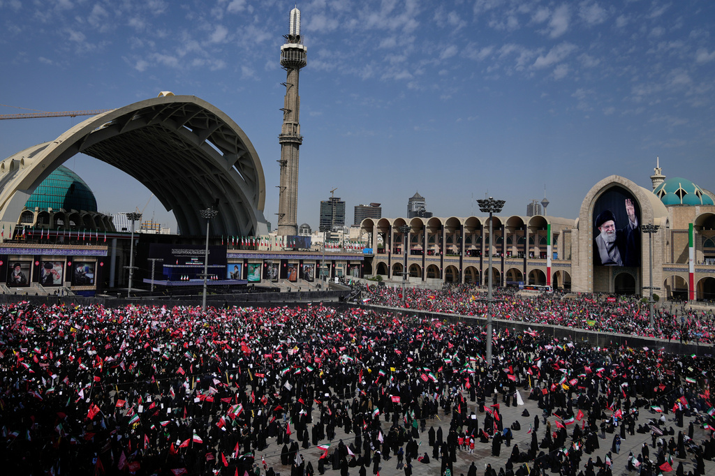 Mourners attend the start of the dayslong funeral ceremonies for the late Iranian Supreme Leader Ayatollah Ali Khamenei and members of his family at the Imam Khomeini Mosalla Grand Mosque in Tehran, Iran, Saturday, July 4, 2026. (AP Photo/Altaf Qadri)