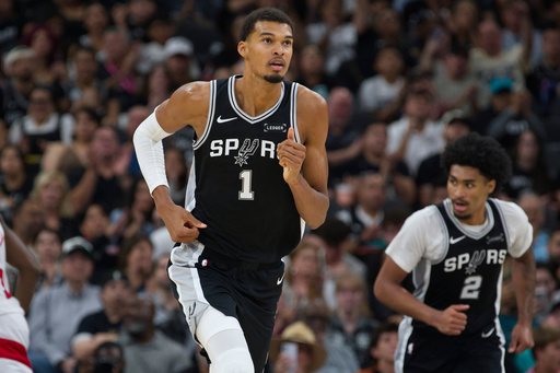San Antonio Spurs center Victor Wembanyama (1) runs up-court during the second half of an NBA basketball game against the Toronto Raptors, Monday, Oct. 27, 2025, in San Antonio. (AP Photo/Darren Abate) San Antonio Spurs center Victor Wembanyama (1) runs up-court during the second half of an NBA basketball game against the Toronto Raptors, Monday, Oct. 27, 2025, in San Antonio. (AP Photo/Darren Abate)