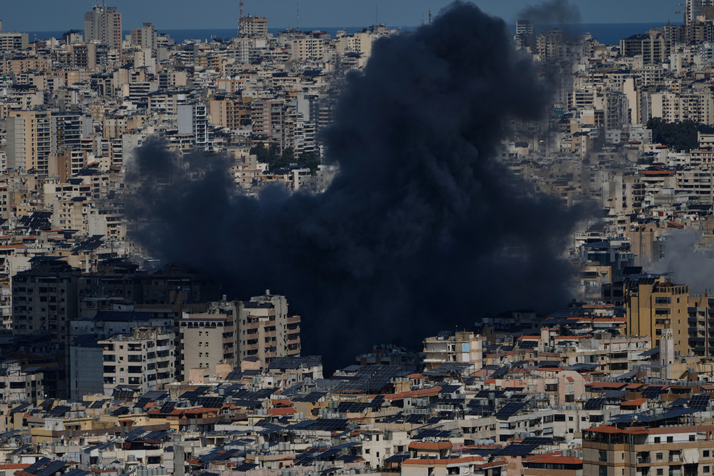 Smoke rises following an Israeli airstrike in Dahiyeh, Beirut's southern suburbs, Lebanon, Monday, March 9, 2026. (AP Photo/Bilal Hussein)