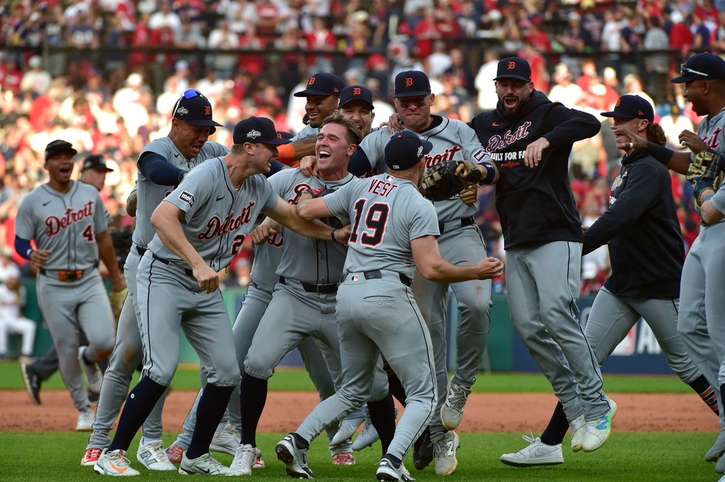 Detroit Tigers players celebrate after winning Game 3 of the American League Wild Card baseball playoff series against the Cleveland Guardians in Cleveland, Thursday, Oct. 2, 2025. (AP Photo/Phil Long)