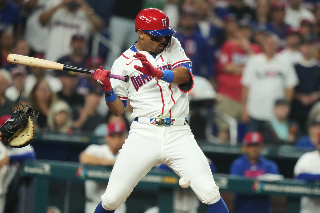 Dominican Republic Julio Rodríguez is hit by a pitch during the fourth inning of a World Baseball Classic semifinal game against the United States, Sunday, March 15, 2026, in Miami. (AP Photo/Lynne Sladky)