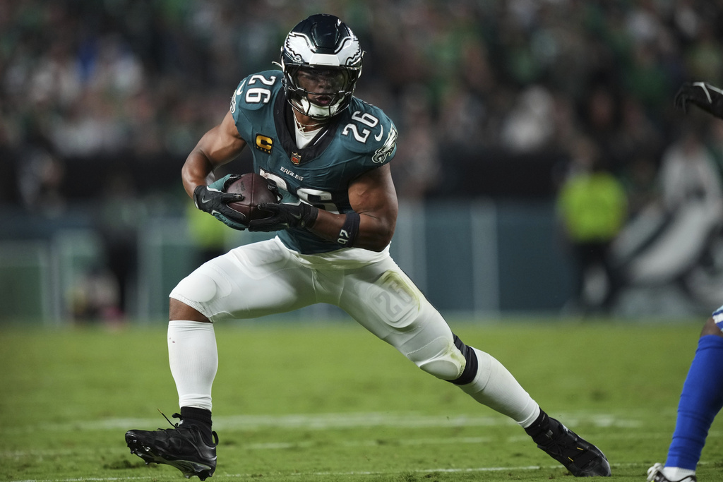 Philadelphia Eagles running back Saquon Barkley runs the ball against the Dallas Cowboys in the first half of an NFL football game Thursday, Sept. 4, 2025, in Philadelphia. (AP Photo/Matt Slocum)