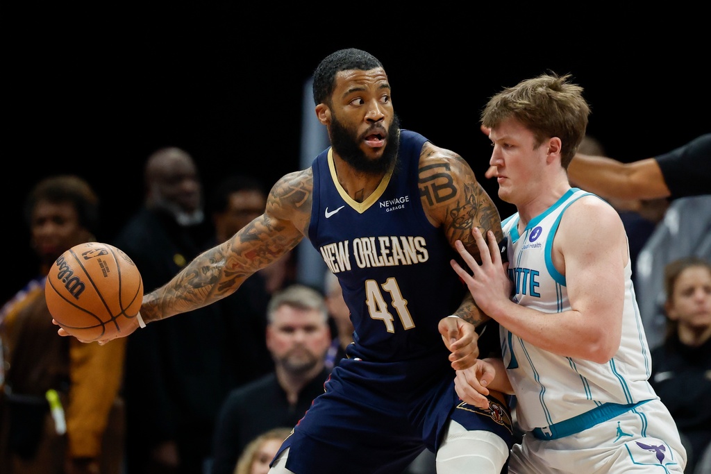New Orleans Pelicans guard Saddiq Bey (41) looks to pass the ball against Charlotte Hornets guard Kon Knueppel, right, during the first half of an NBA basketball game in Charlotte, N.C., Monday, Feb. 2, 2026. (AP Photo/Nell Redmond)