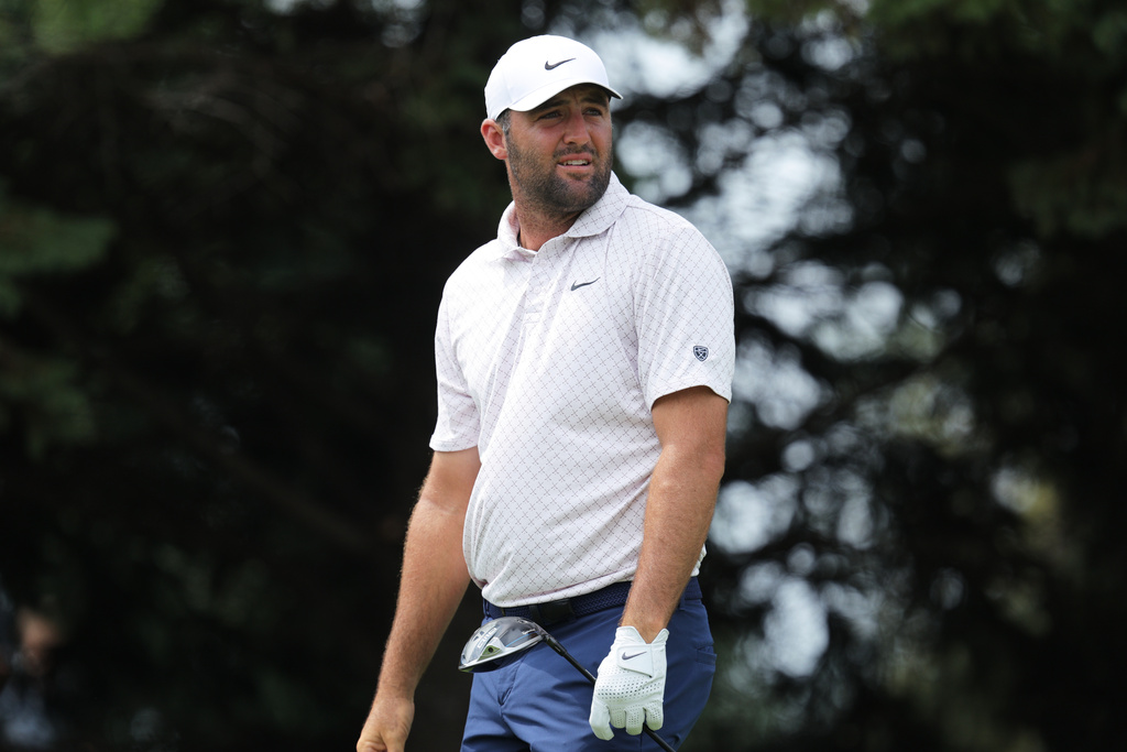 Scottie Scheffler reacts to his shot from the second tee during the final round of the 3M Open golf tournament at the Tournament Players Club Sunday, July 26, 2026, in Blaine, Minn. (AP Photo/Bailey Hillesheim)