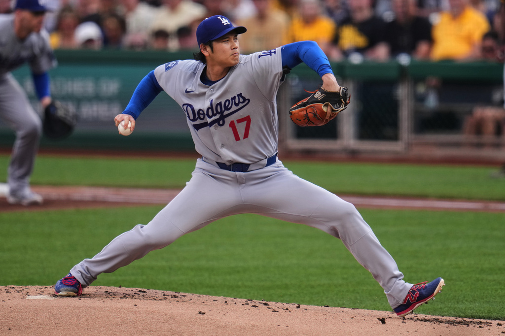 Los Angeles Dodgers two-way player Shohei Ohtani delivers during the first inning of a baseball game against the Pittsburgh Pirates in Pittsburgh, Wednesday, June 10, 2026. (AP Photo/Gene J. Puskar)