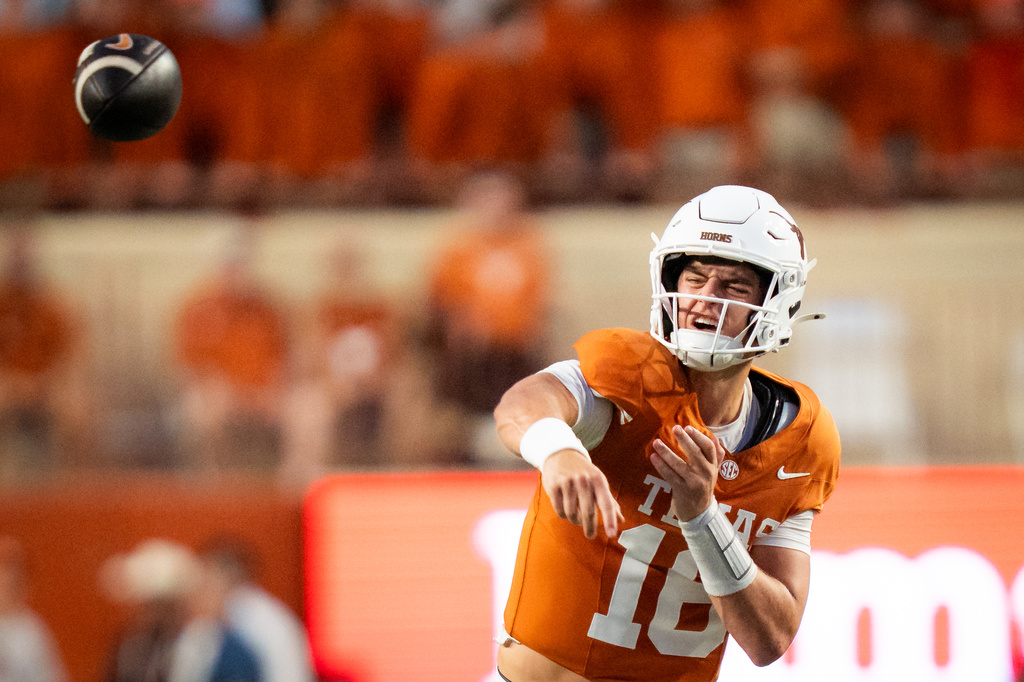 Texas Longhorns quarterback Arch Manning (16) passes the ball in the second quarter of an NCAA college football game against Ohio State in Austin, Texas, Saturday, Sept. 12, 2026. (Sara Diggins/The San Antonio Express-News via AP)