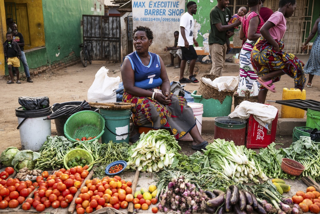 A woman sells vegetables in Blantyre, Malawi, Tuesday, Sept. 16, 2025. (AP Photo/Thoko Chikondi)
