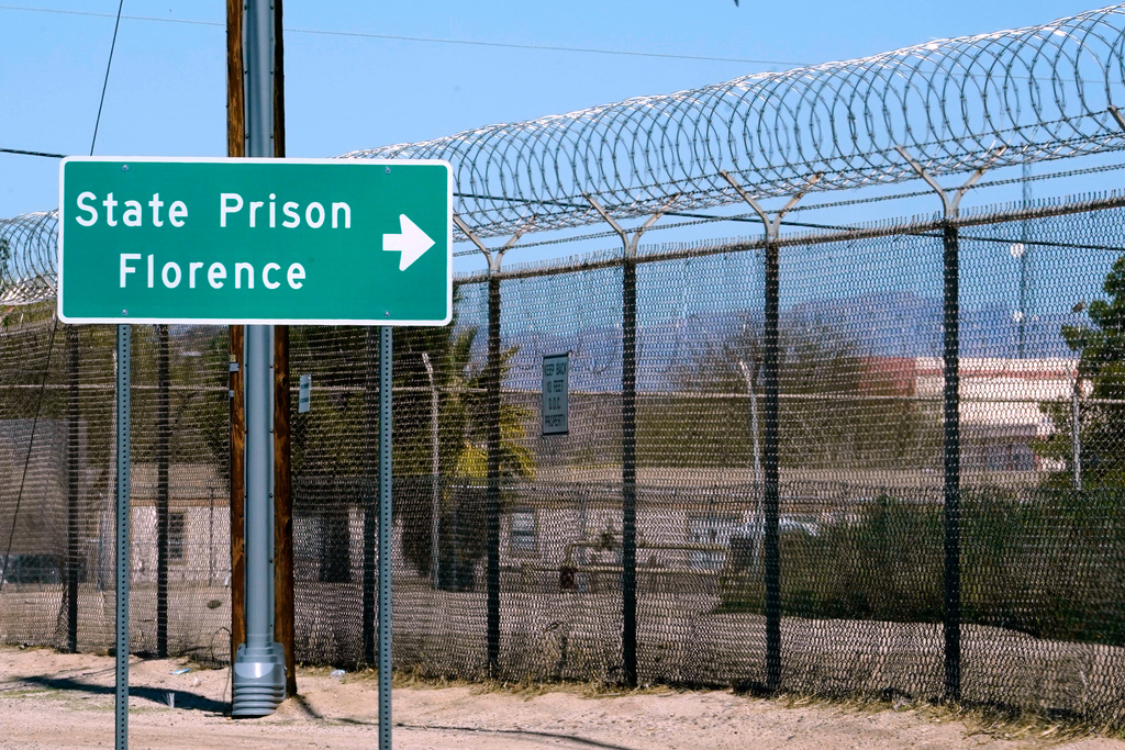 FILE - A sign points in the direction of the Arizona State Prison in Florence, Ariz., March 19, 2025. (AP Photo/Darryl Webb, File)