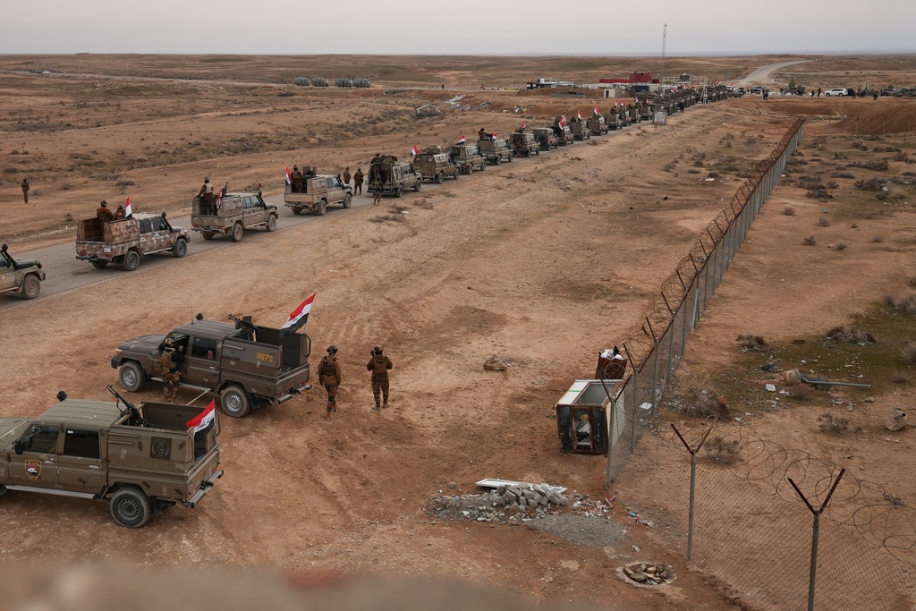 Iraqi Border Guards deploy along the Syrian border amid heightened security following recent fighting in Syria, in Sinjar, northern Iraq, Thursday, Jan. 22, 2026. (AP Photo/Farid Abdulwahed)