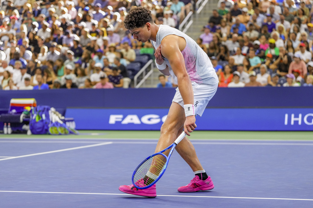 Ben Shelton, of the United States, reacts after a rally against Adrian Mannarino, of France, during the third round of the U.S. Open tennis championships, Friday, Aug. 29, 2025, in New York. (AP Photo/Kirsty Wigglesworth)