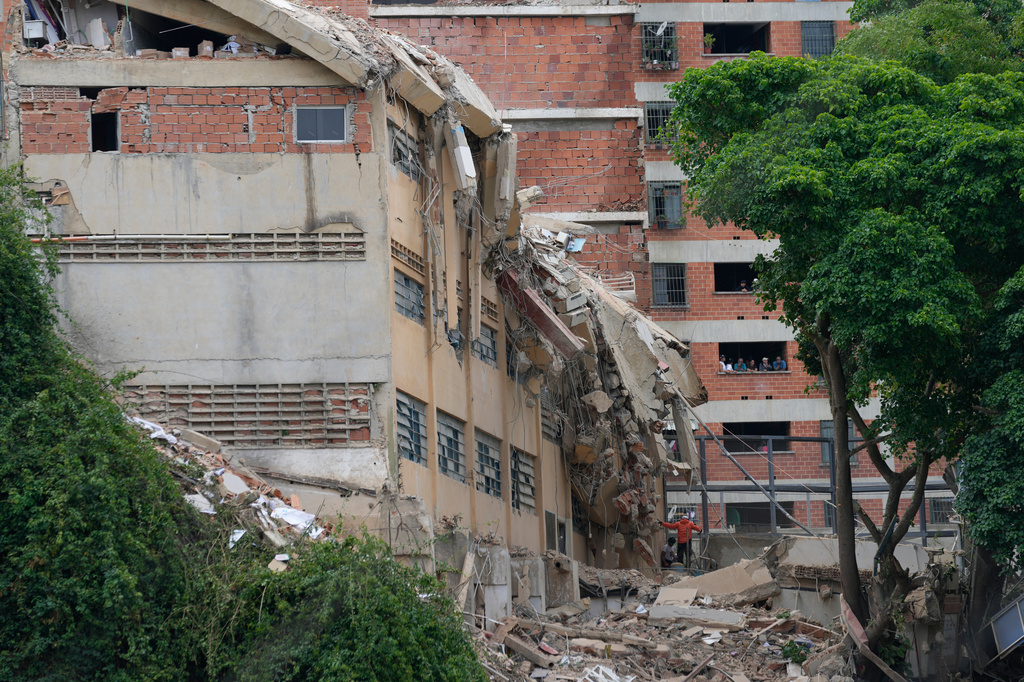 Part of the San Judas Tadeo school collapsed in Caracas, Venezuela, Friday, July 3, 2026, days after it was damaged in the earthquakes. (AP Photo/Ariana Cubillos)