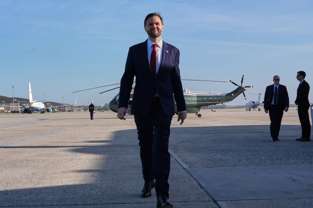 Vice President JD Vance walks to speak with the Press before boarding Air Force Two, Friday, April 10, 2026, at Joint Base Andrews, Md., for expected departure to Pakistan, for talks on Iran. (AP Photo/Jacquelyn Martin, pool)