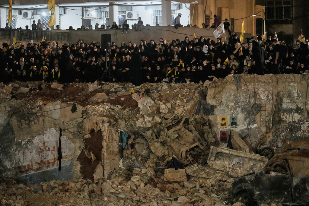 People gather at the site where Hezbollah leader Hassan Nasrallah was killed in Israeli airstrikes on Sept. 27, 2024, a day before the first anniversary of his death, in the Haret Hreik suburb south of Beirut, Lebanon, Friday, April 26, 2025. (AP Photo/Hassan Ammar)