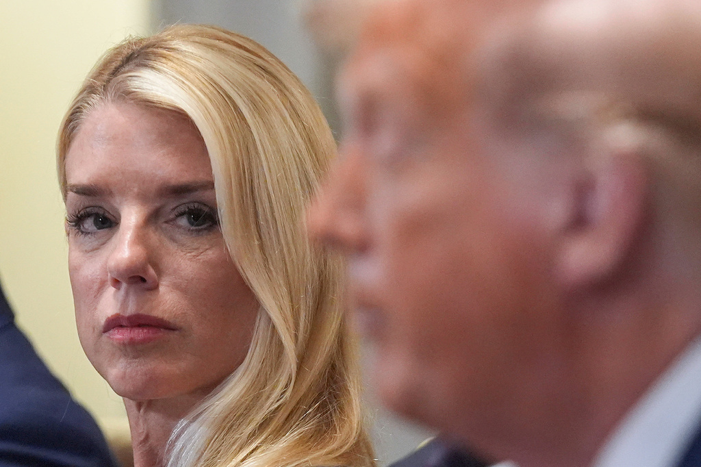 FILE - Attorney General Pam Bondi, left, listens as President Donald Trump, right, speaks during a cabinet meeting at the White House, July 8, 2025, in Washington. (AP Photo/Evan Vucci, File)