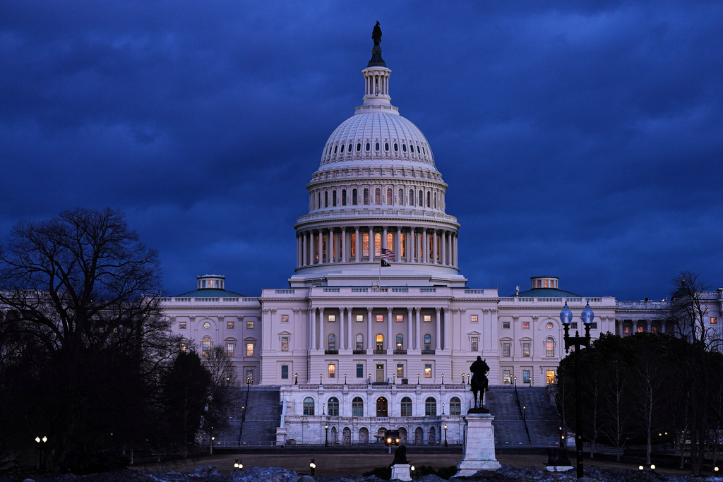 The U .S. Capitol is seen after sunset in Washington, Monday, Feb. 23, 2026, ahead of President Donald Trump's State of the Union address. (AP Photo/Matt Rourke)
