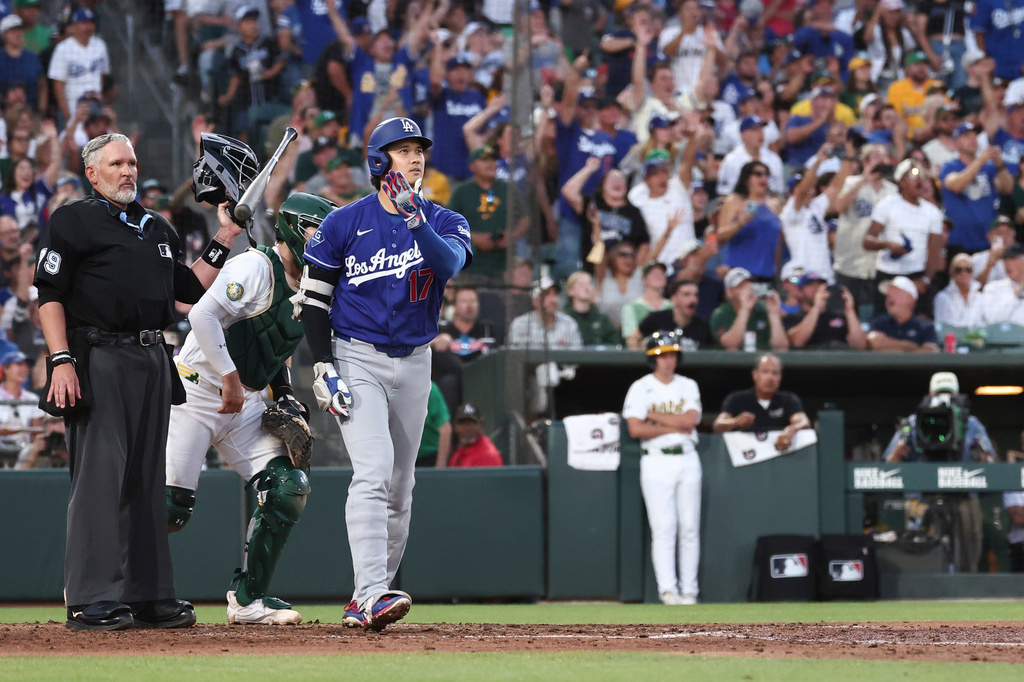 Los Angeles Dodgers' Shohei Ohtani watches after hitting a three-run home run during the sixth inning of a baseball game against the Athletics Monday, June 29, 2026, in West Sacramento, Calif. (AP Photo/Sara Nevis)