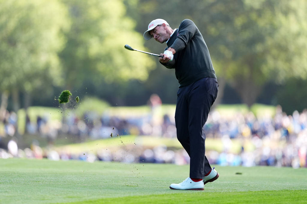 Australia's Adam Scott plays from the 7th fairway on day two of the PGA Championship at Wentworth Golf Club, in Virginia Water, England, Friday, Sept. 18, 2026. (Adam Davy/PA via AP)
