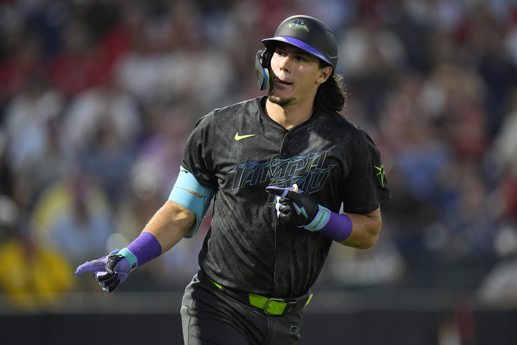 Tampa Bay Rays' Tristan Gray points into the dugout after hitting a two-run home run off St. Louis Cardinals pitcher Miles Mikolas during the second inning of a baseball game Friday, Aug. 22, 2025, in Tampa, Fla. (AP Photo/Chris O'Meara)