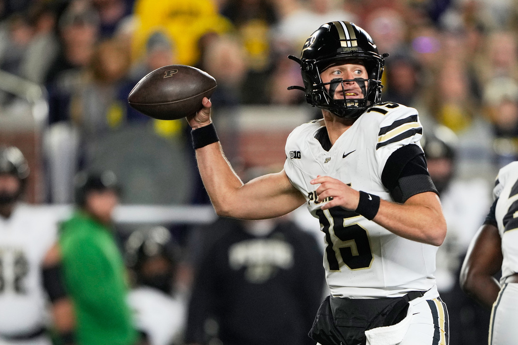 Purdue quarterback Ryan Browne throws during the first half of an NCAA college football game against Michigan, Saturday, Nov. 1, 2025, in Ann Arbor, Mich. (AP Photo/Ryan Sun)