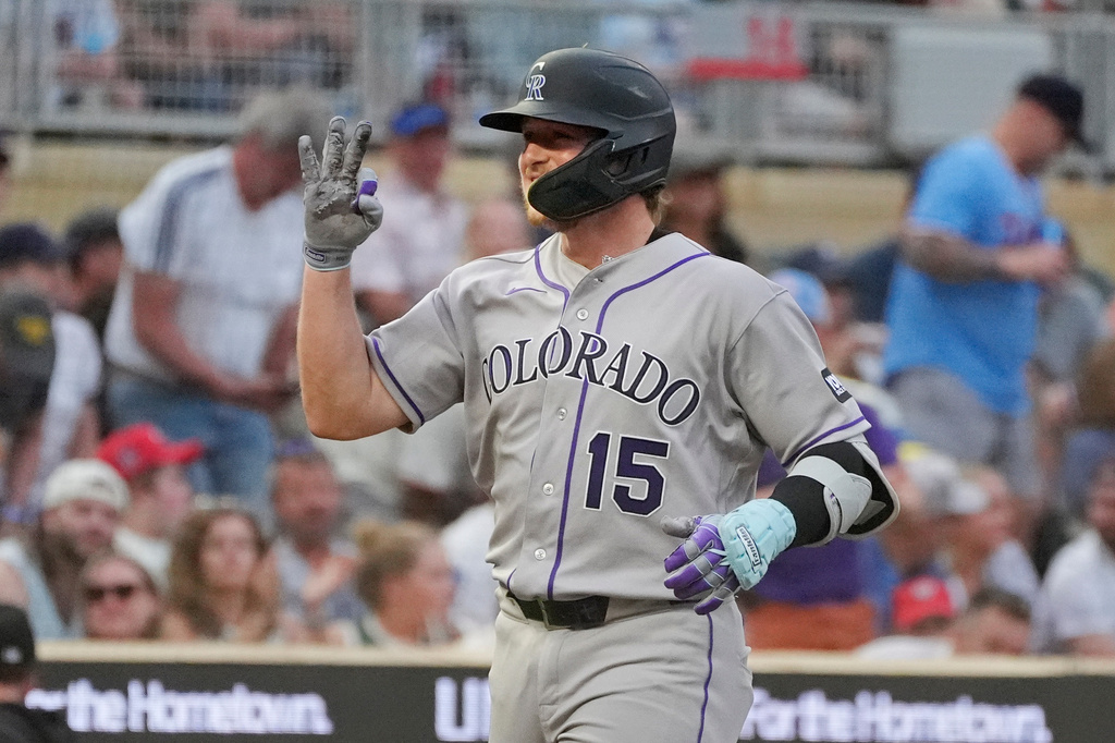 Colorado Rockies' Hunter Goodman runs the bases on his three-run home run against the Minnesota Twins in the seventh inning of a baseball game Saturday, June 27, 2026, in Minneapolis. (AP Photo/Bruce Kluckhohn)
