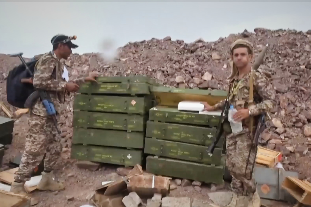 This image taken from undated video released by the Ansar Allah Media Office, the media arm of Yemen's Houthi rebels, on Saturday, Sept. 12, 2026, shows Houthi fighters inspecting what the group says is an abandoned position during their advance against Saudi-backed forces at an undisclosed location in southern Yemen. (Ansar Allah Media Office via AP)